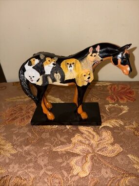 Black and Orange Horse Sculpture Featuring Dog Portraits